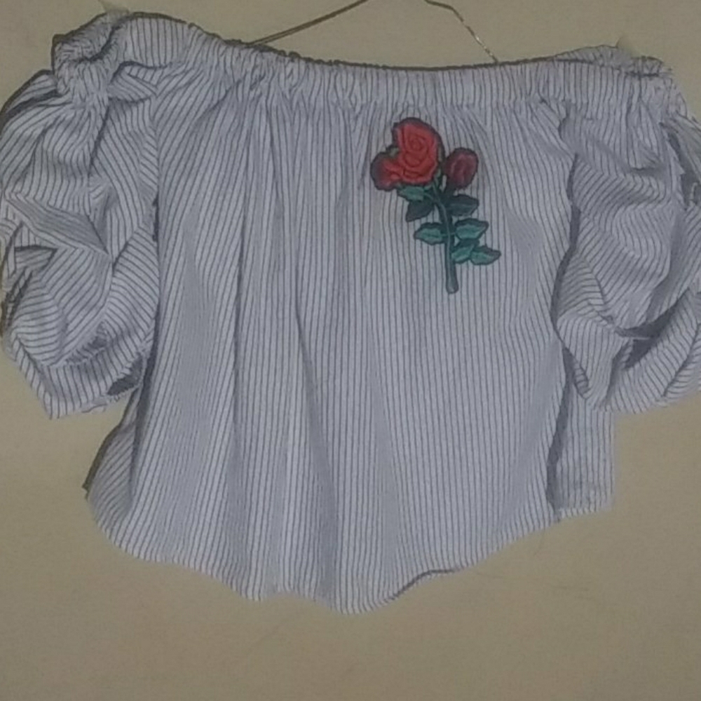 A black and white stripped off the shoulder shirt